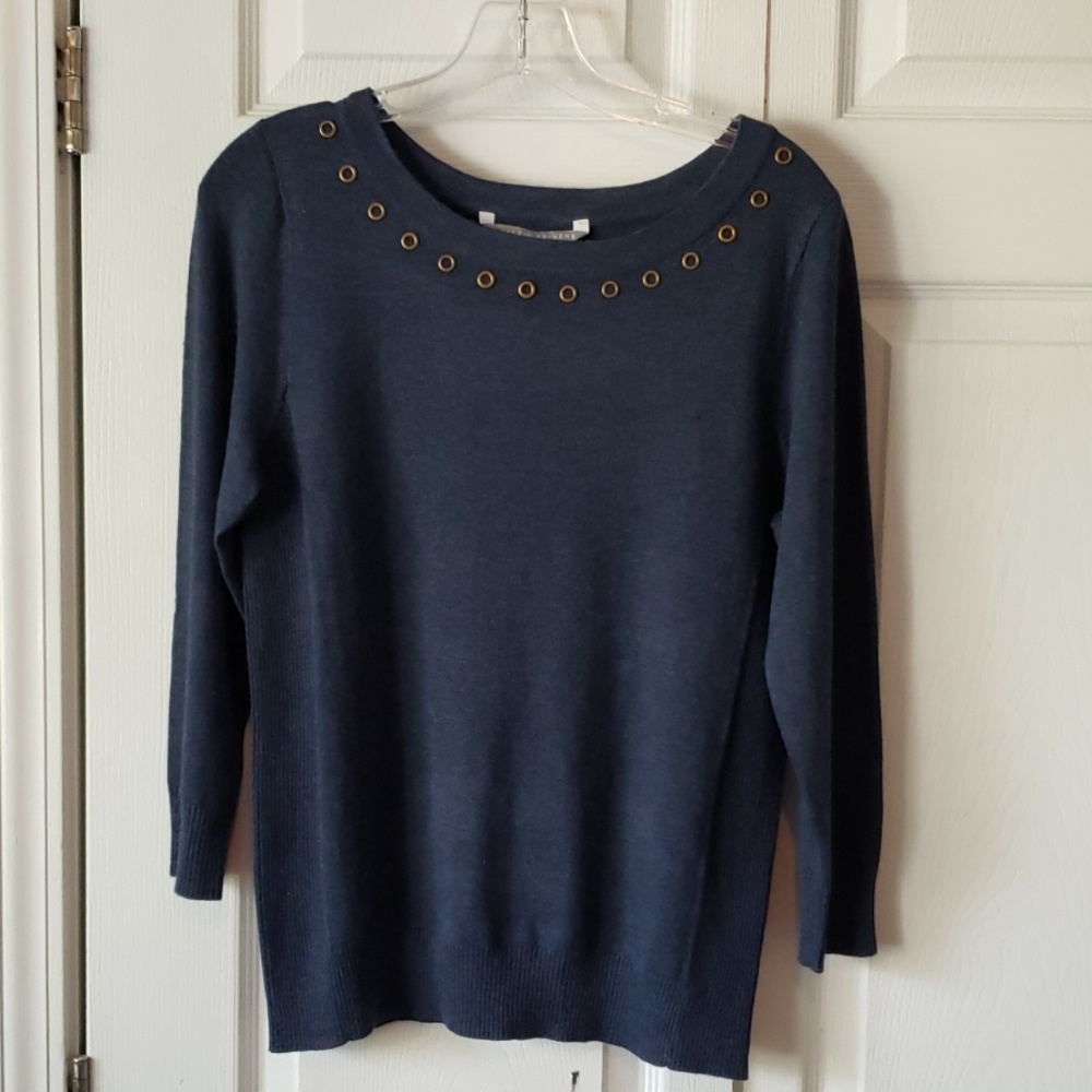 Soft sweater with grommet accents
